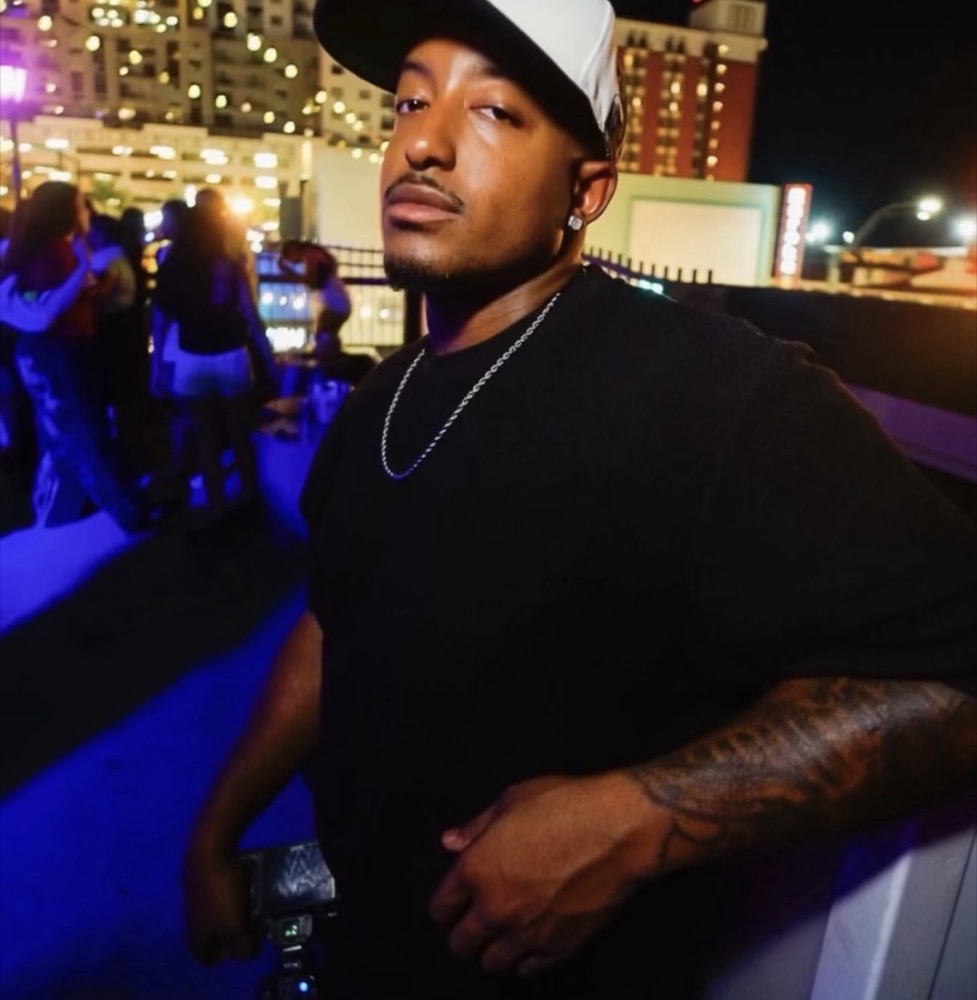 Ahmere Allen on a downtown Las Vegas rooftop with his camera